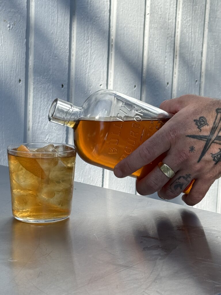 tattoo hand pouring old fashioned